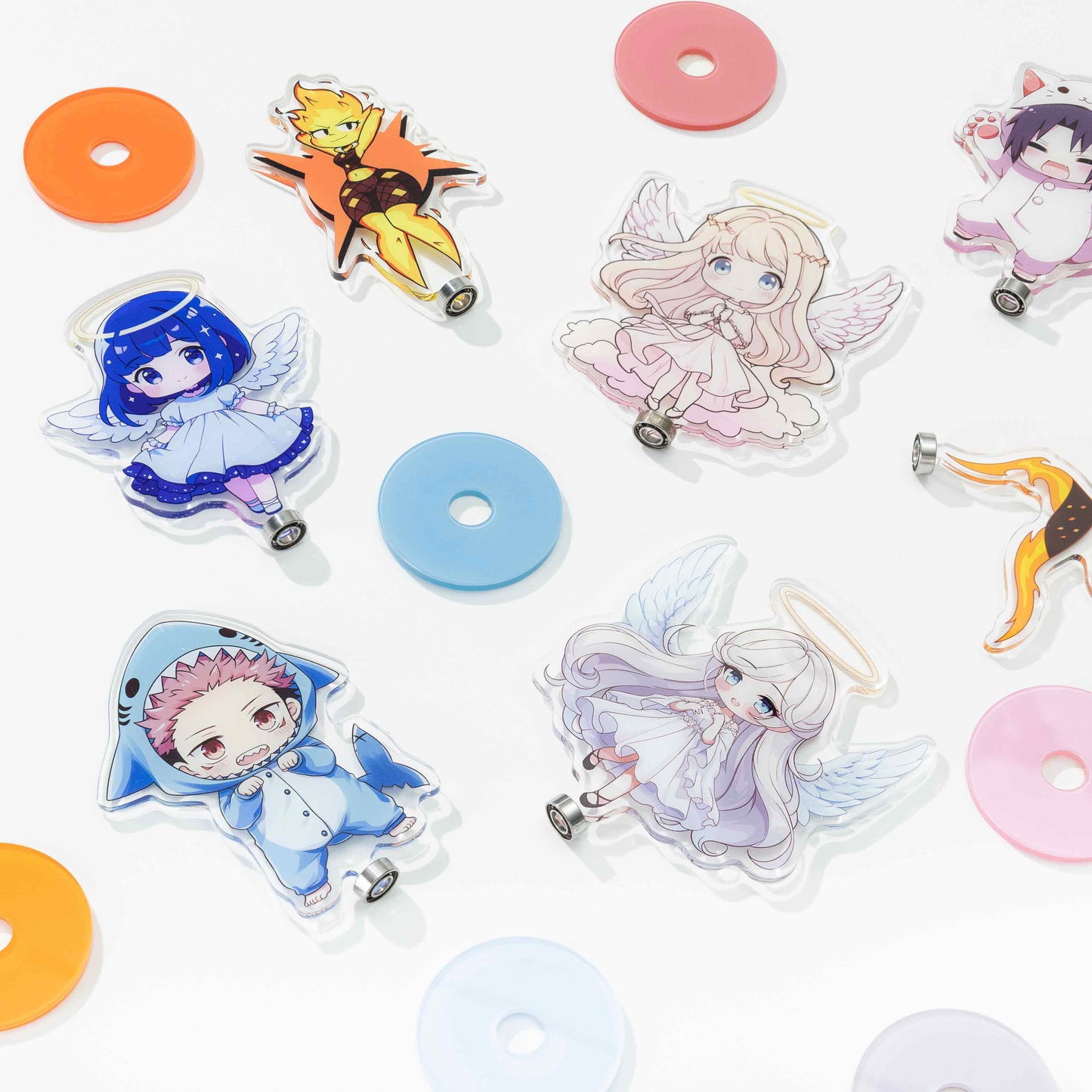 Assorted custom rotating acrylic standee parts, anime character cutouts and colorful round bases flat display