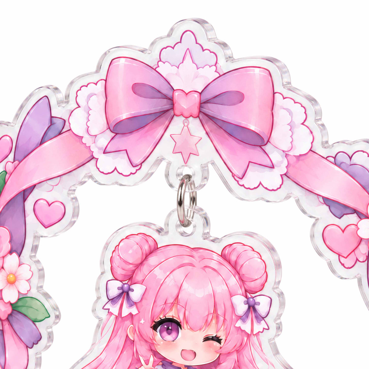 A close-up of a hanging acrylic "wobbler" stand featuring a wreath design, alongside a custom acrylic stand printed with a chibi-style anime character.