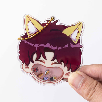 Finished acrylic shaker charm held in hand, cute cat‑ear character with movable mini‑food pieces inside cavity.