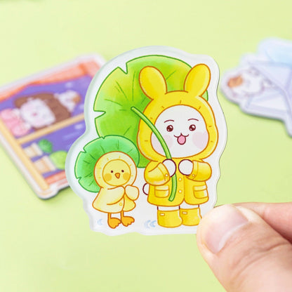 A-refrigerator-magnet-featuring-a-stylized-character-wearing-a-yellow-raincoat