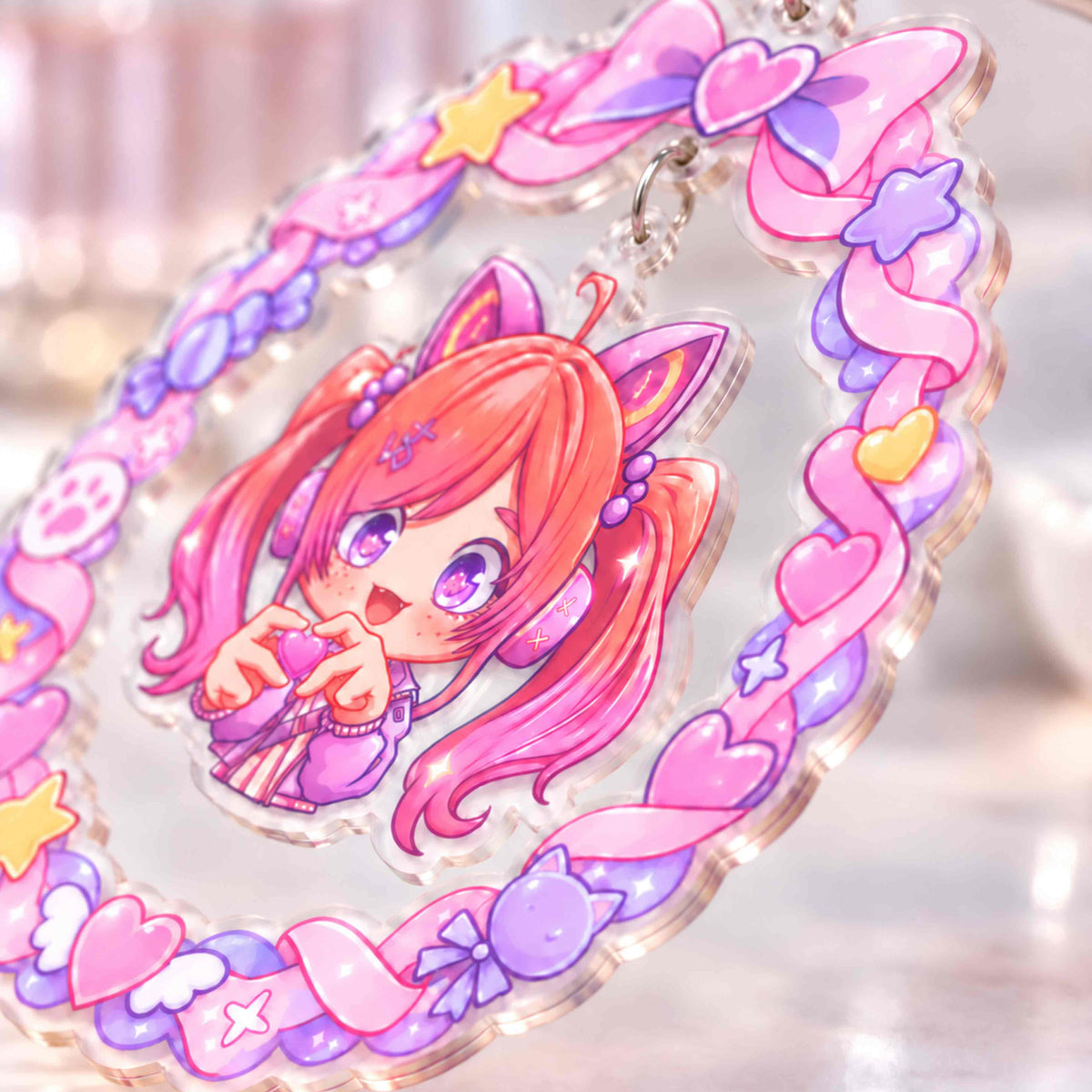 Close-up of a custom acrylic shaker keychain: a transparent acrylic bag charm perfect for anime merchandise.
