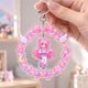 Kawaii pink anime girl acrylic wobble keychain with wreath, bow and wing decoration, bag pendant