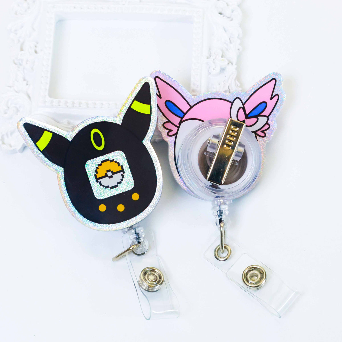 Two holographic badge reels, glitter acrylic cartoon character retractable clip