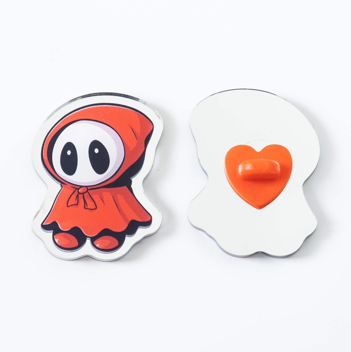Mirror-bottom_irregular_acrylic_brooch_paired_with_heart-shaped_rubber_pin_and_heart-shaped_brooch._Front_and_back_views