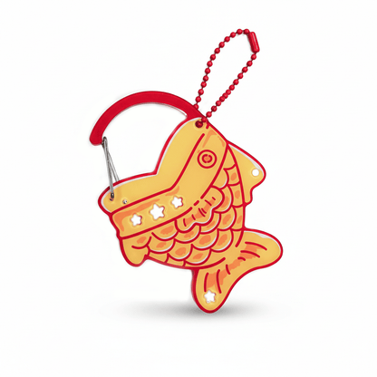 Orange_acrylic_fish-shaped_carabiner_keychain_with_star_and_heart-shaped_pendants.