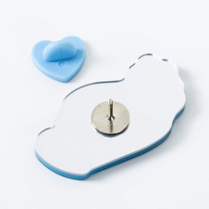 The_mirrored_acrylic_brooch_is_shown_from_both_sides_featuring_a_metal_pin_and_a_heart-shaped_rubber_clasp.